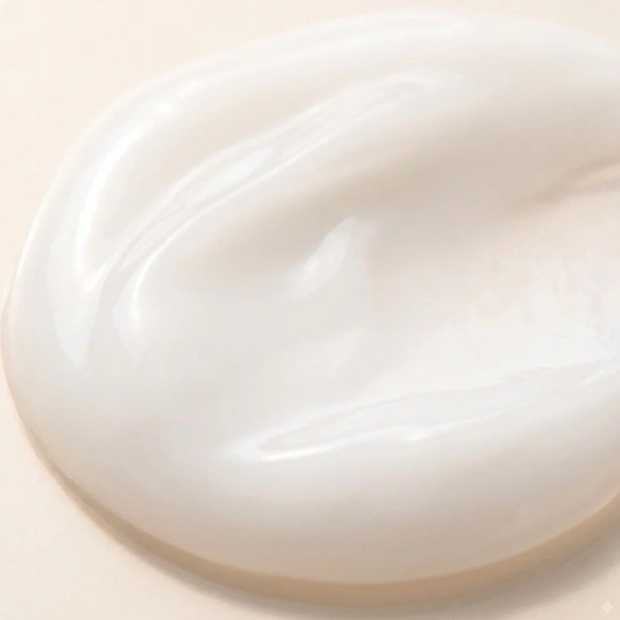 Textura leve do creme do leave-in